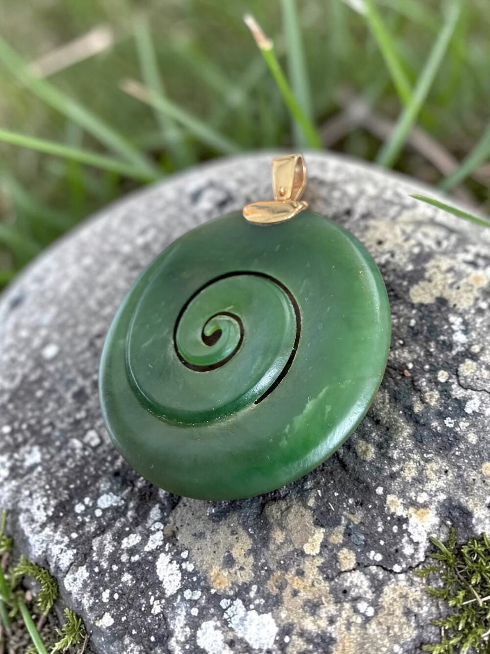 Vintage 14k gold pounamu spiral pendant carved disc swirl motif